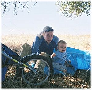 Naomi and Lando in the shade under a tree