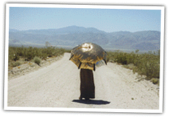 Joy hiking with her reflective umbrella